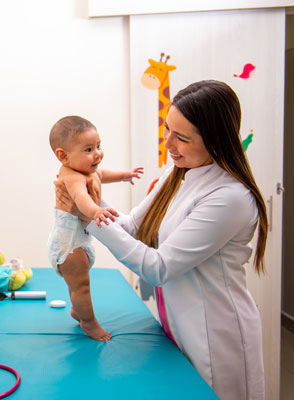 A doctor examining a baby