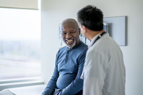 A patient talking with his doctor