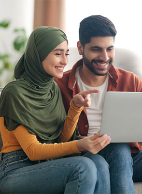 A young couple explores benefits on tablet together