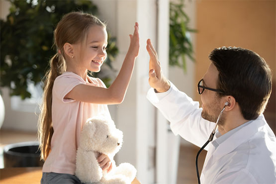 Medicaid provider high fives a happy child